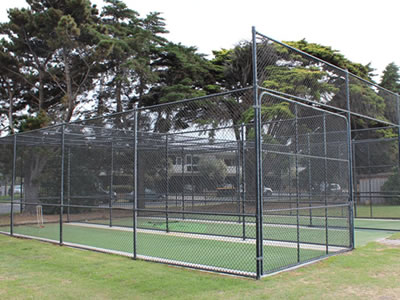 This is a black coated cricket practice net enclosure.