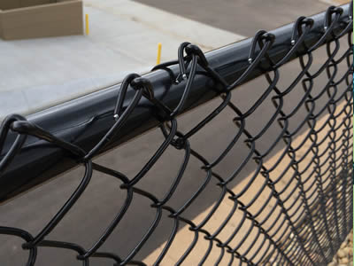 A piece of black PVC coated chain link fence is installed on the fence post.