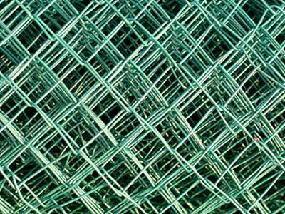 A detail of diamond meshes of PVC coated chain link fence.