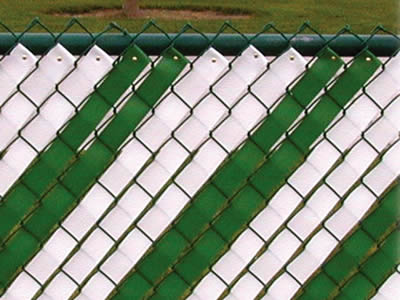 A piece of chain link fence with white and green slats.