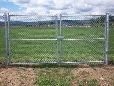 Aluminum-coated chain link fabric gates for grassland field fence.