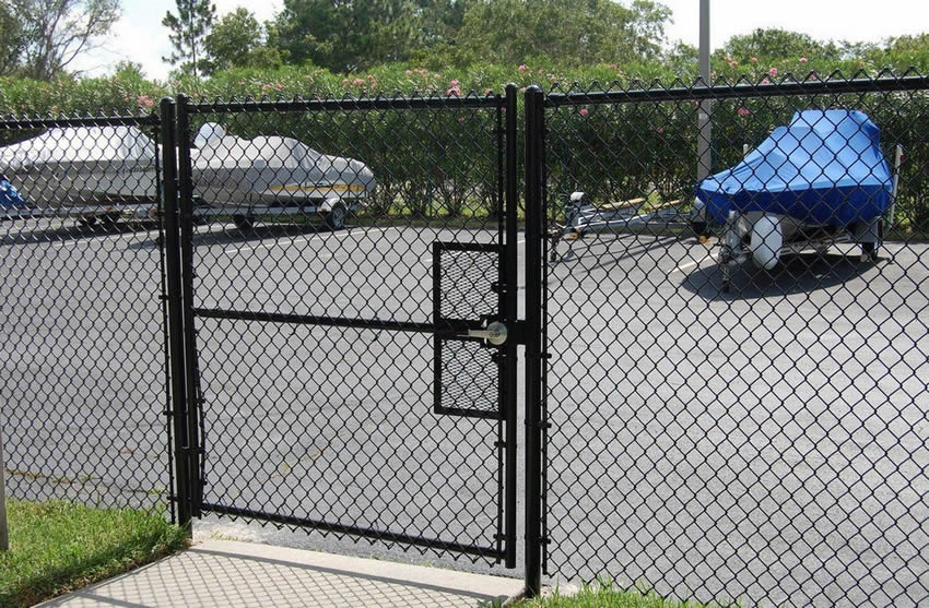 Black chain link fences with gate are installed in the parks.