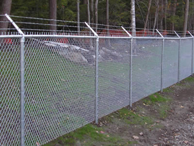 With three lines of barbed wire topping, chain link fence is installed for plant fencing.