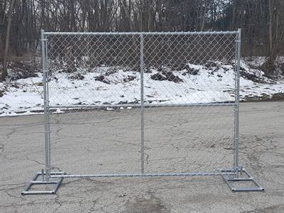 A piece of temporary chain link fence are fastened to the frame with tension bars.